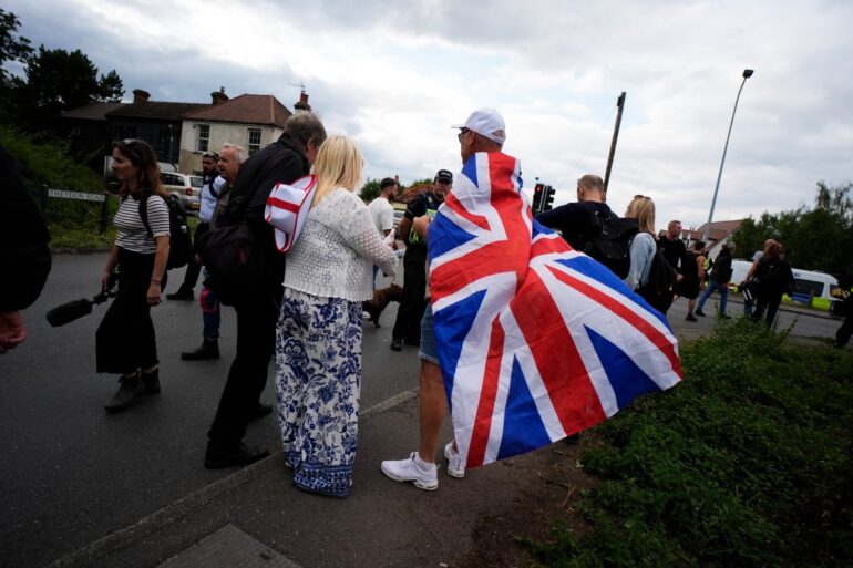 Protesters Stage Demo Outside Hotel Used To House Migrants